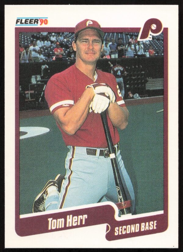 Tom Herr 1990 Fleer Baseball Card #560, classic pose with uniform and team logo.