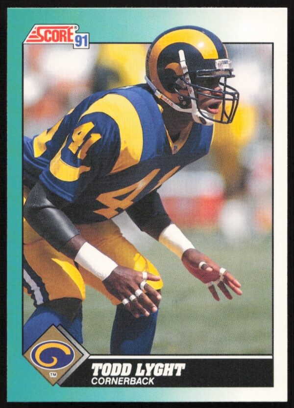 Front of 1991 Score Supplemental football card featuring Todd Lyght in action, card #90T.