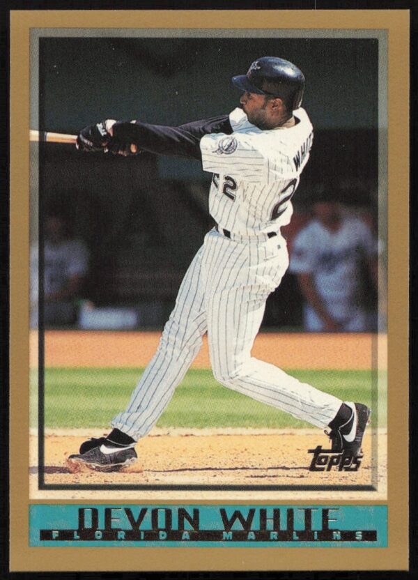 Devon White in action, 1998 Topps Baseball Card #47, showcasing athletic pose and stadium backdrop.
