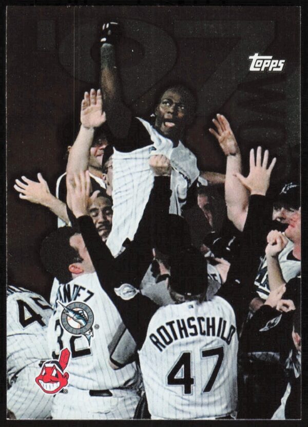 1998 Topps card: Florida Marlins celebrate 1997 World Series win over Cleveland Indians.