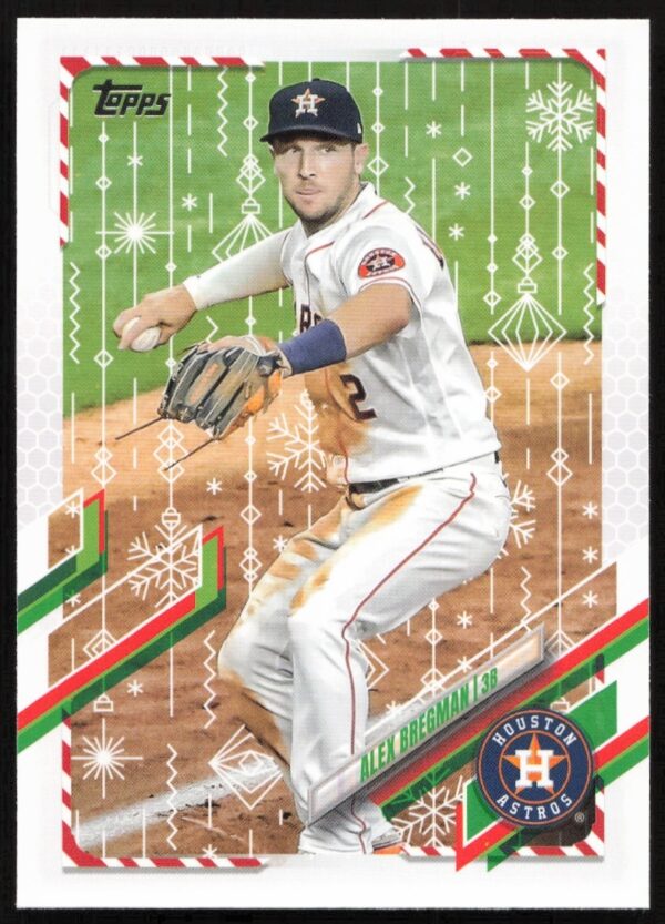 Alex Bregman 2021 Topps Holiday card with festive background, Houston Astros infielder action shot.