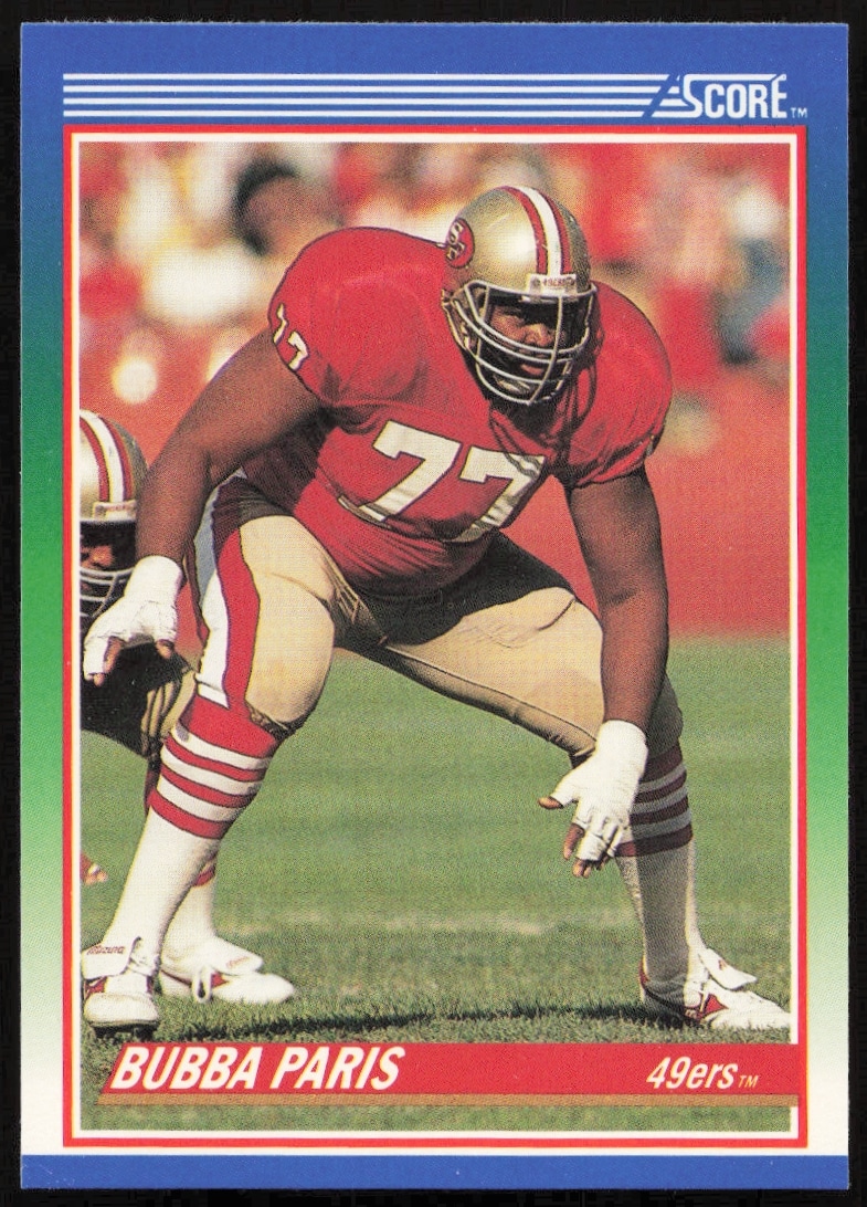 1990 Score Football Card #77: Bubba Paris in action, NFL vintage collection.