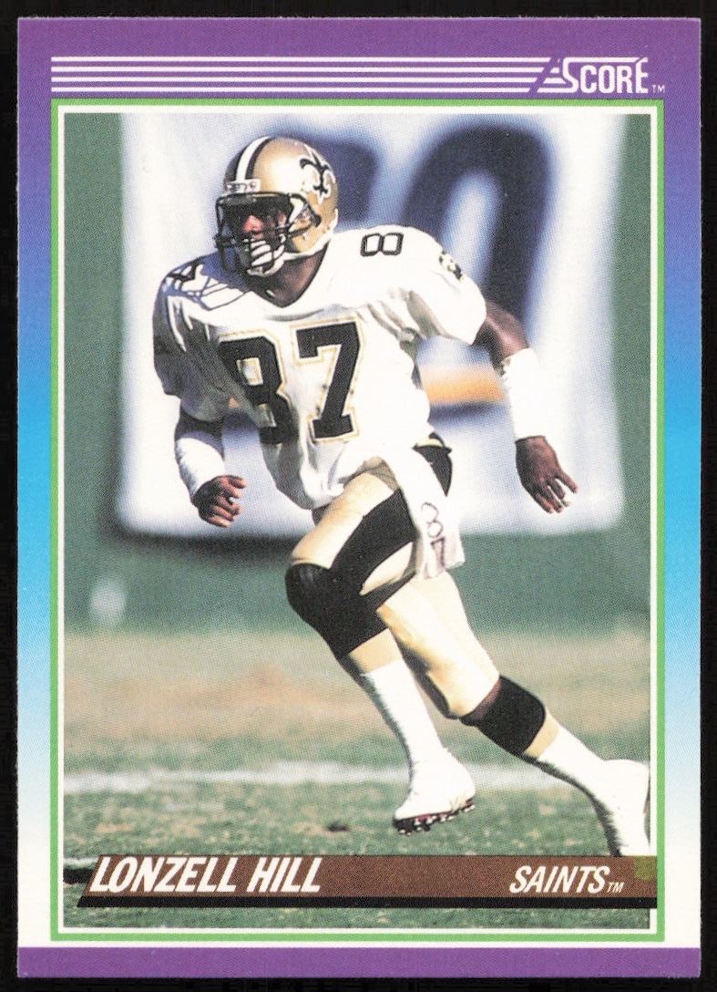 Front of 1990 Score Lonzell Hill card showing New Orleans Saints wide receiver in action.