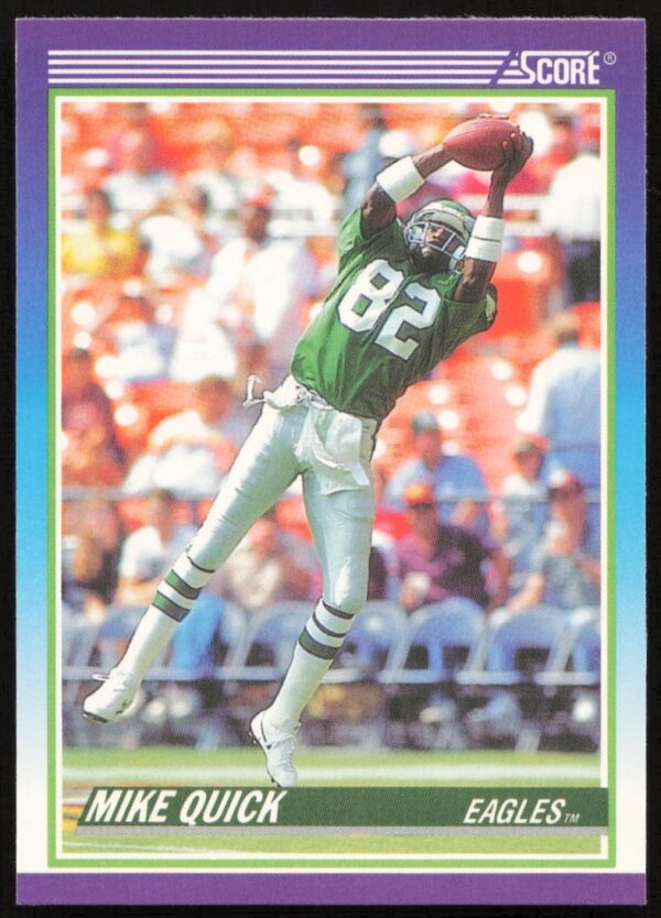 Front view of 1990 Score Mike Quick card #466 featuring Eagles receiver in action.