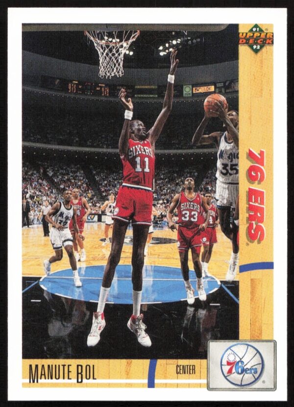 Manute Bol 1991 Upper Deck Card #178 Front, showcasing his defensive prowess on the court.