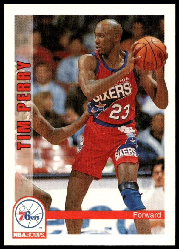 Tim Perry 1992-93 NBA Hoops card #448 front, showcasing agility and focus in team uniform.