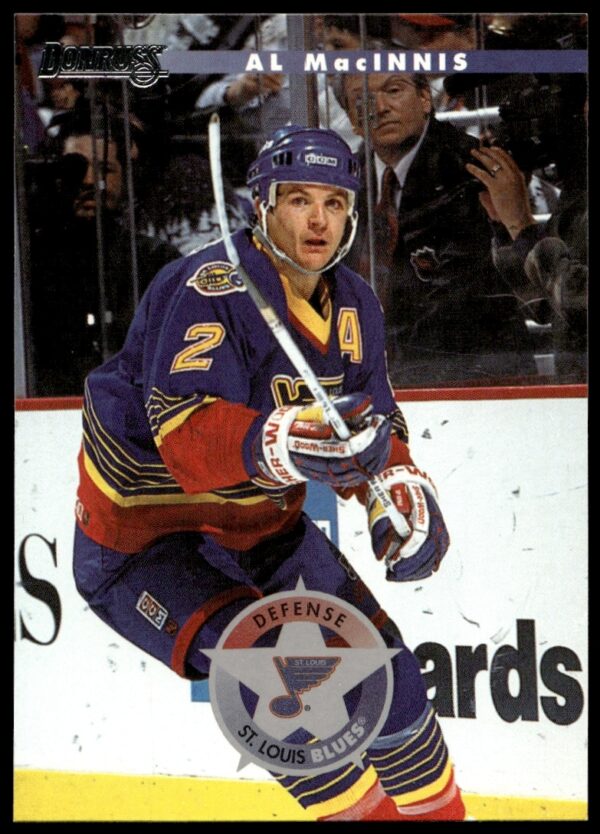 Front of 1996-97 Donruss card featuring Al MacInnis, St. Louis Blues defenseman, #12.