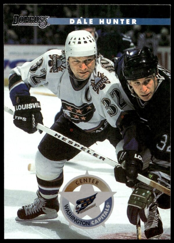 Dale Hunter 1996-97 Donruss trading card #199, Washington Capitals uniform, gameplay moment.