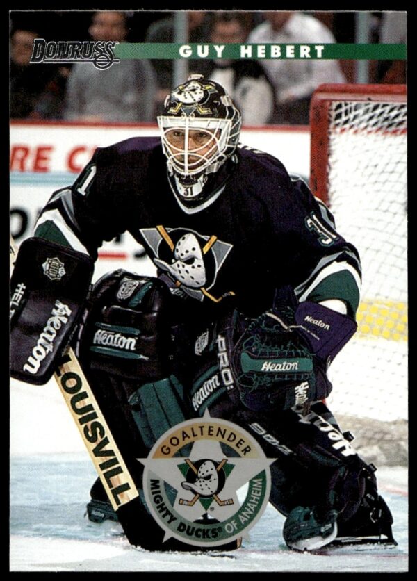 Guy Hebert 1996-97 Donruss hockey card showing action pose in Anaheim Mighty Ducks uniform.