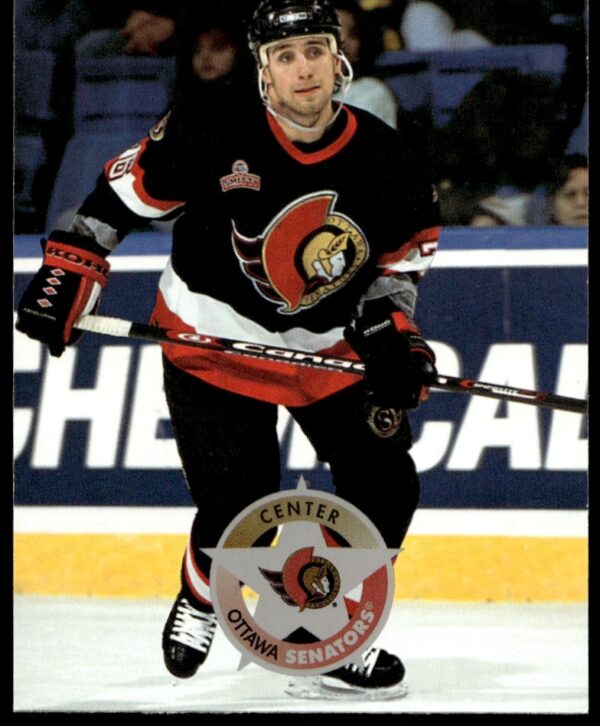 Radek Bonk 1996-97 Donruss Hockey Card #128: Iconic action shot, collectors must-have.