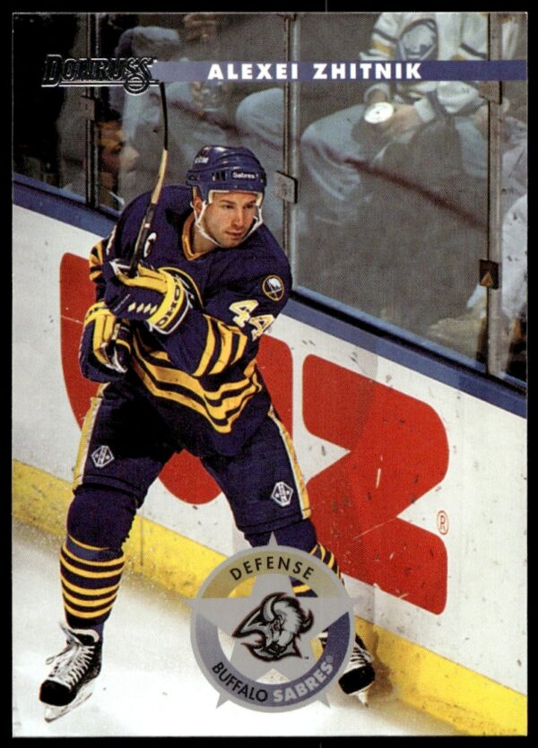 1996 Donruss Hockey Card of Alexei Zhitnik #11 in action.