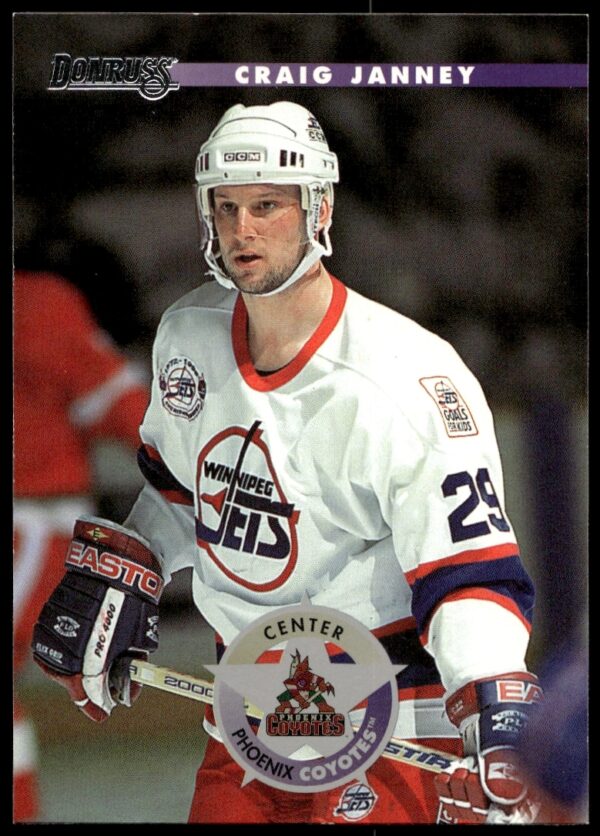 Front view of 1996 Donruss hockey card featuring Craig Janneys action shot.
