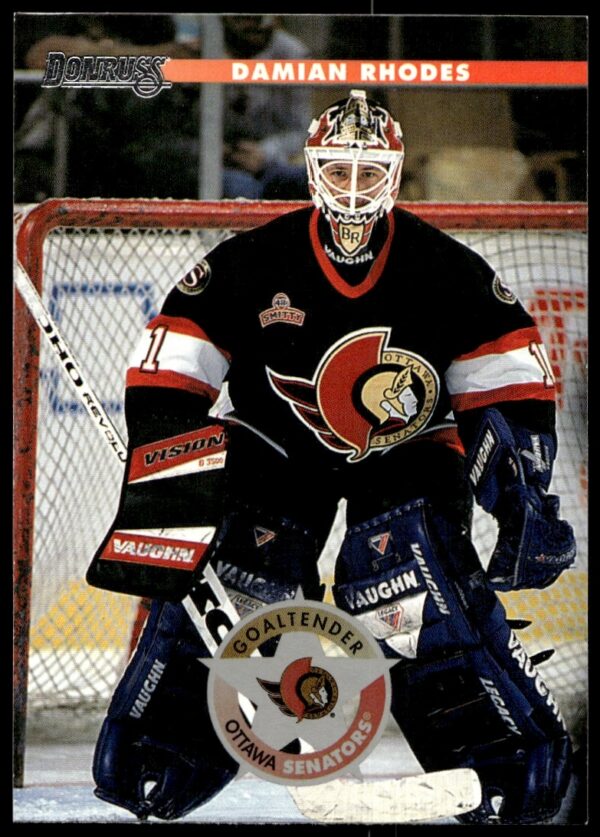 1996 Donruss Hockey Card #156: Damian Rhodes in action, goaltending gear on display.