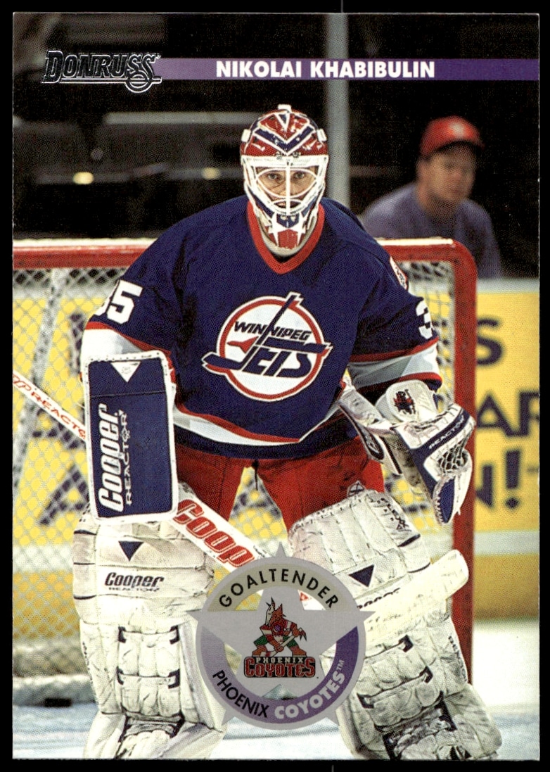 1996 Donruss hockey card featuring Tampa Bay Lightnings goalie Nikolai Khabibulin in action.
