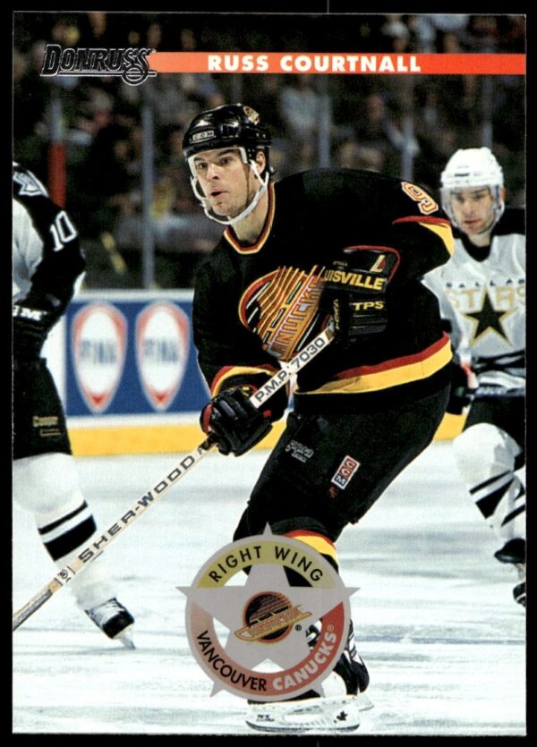 Russ Courtnall 1996 Donruss Trading Card #194 featuring NHL action shot, team uniform.