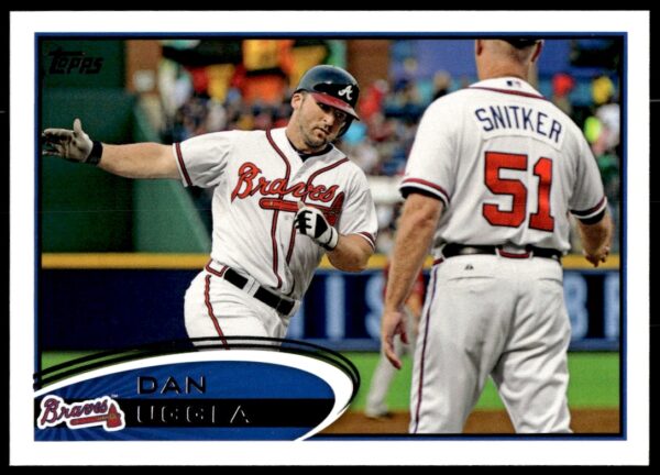 Dan Uggla 2012 Topps baseball card #565, featuring athlete in action.