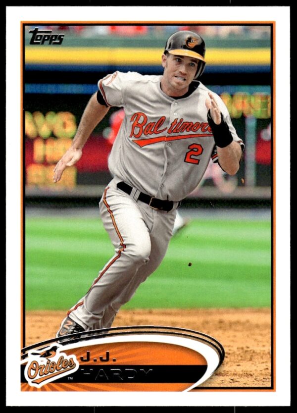 2012 Topps J.J. Hardy baseball card #571, featuring dynamic in-game action front view.