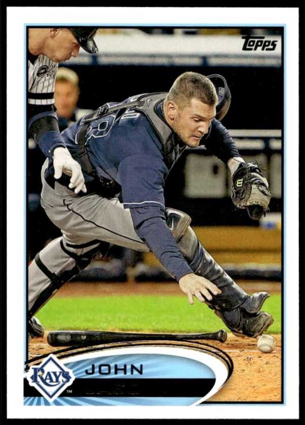John Jaso 2012 Topps Baseball Card #271, catcher poised with bat during game.