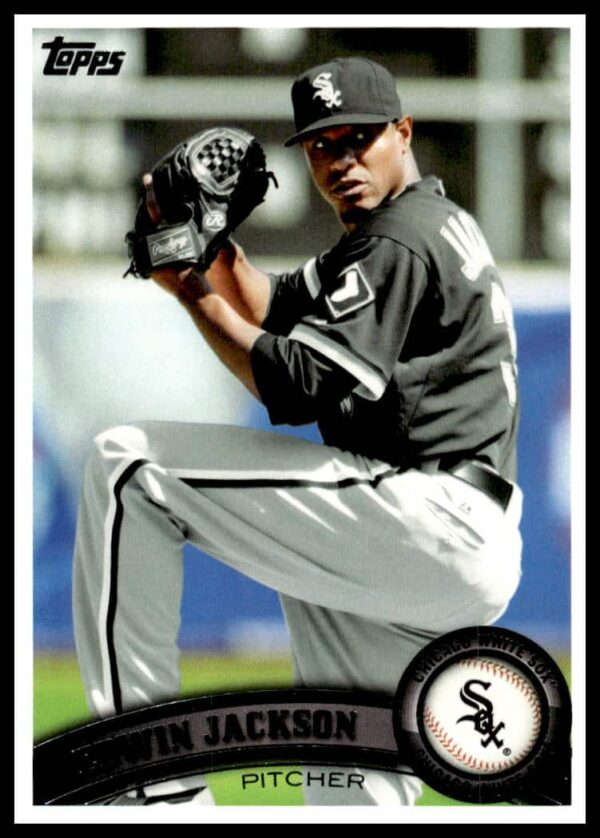 Edwin Jackson pitching, 2011 Topps baseball card #652, dynamic pose, stadium backdrop.