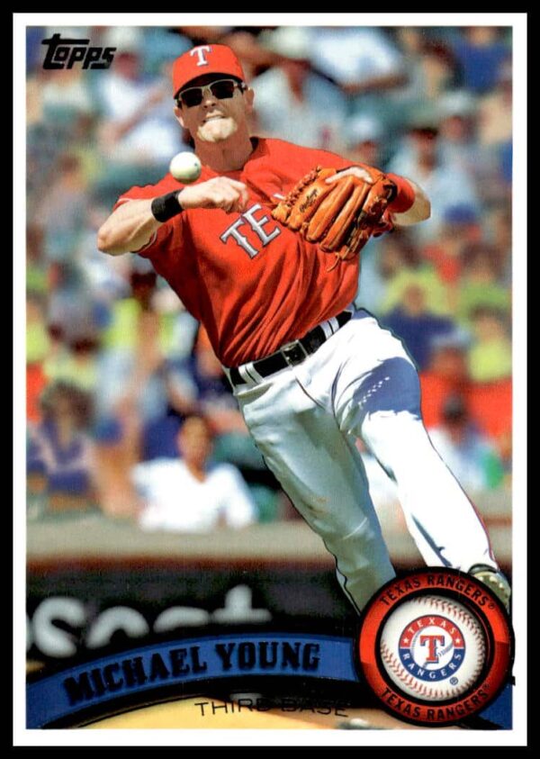 Michael Young 2011 Topps Baseball Card #320, Texas Rangers infielder in action.
