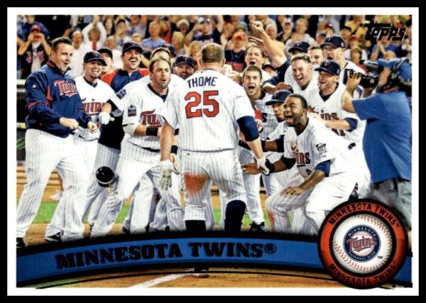 2011 Topps Twins Card #614, featuring Minnesota team action and iconic logo.