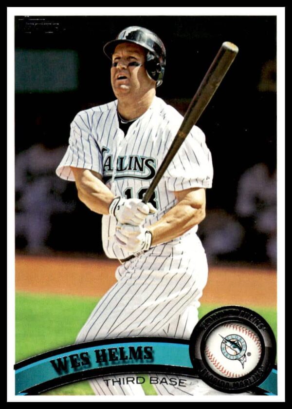 Wes Helms 2011 Topps Baseball Card #557, showcasing vibrant design and player in uniform.