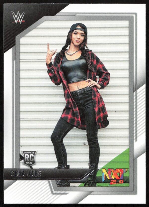 Cora Jades WWE NXT debut card: confident pose in flannel, representing dynamic wrestling talent.