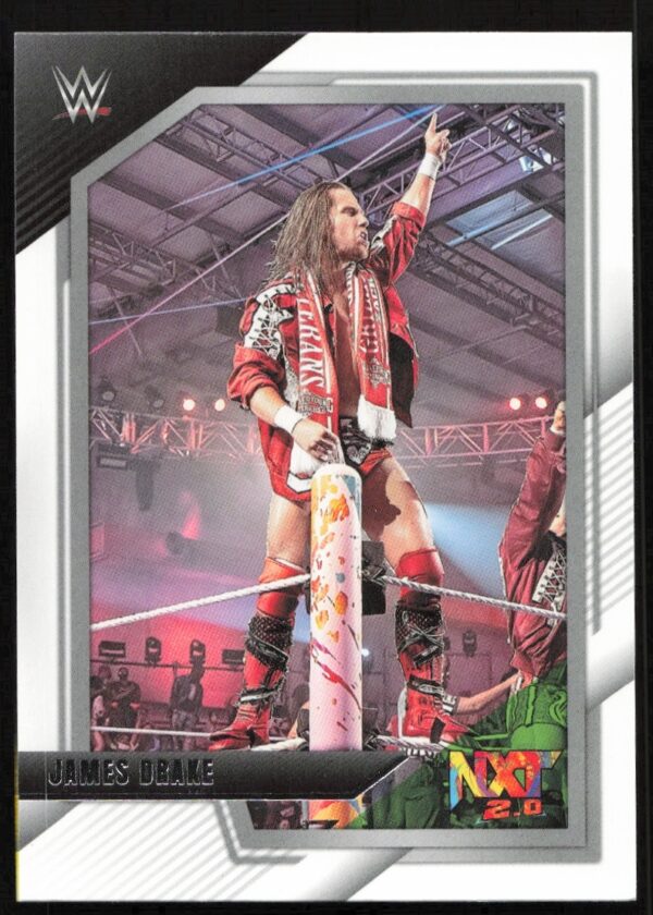 WWE trading card featuring James Drake celebrating triumphantly on the turnbuckle in red and white gear.