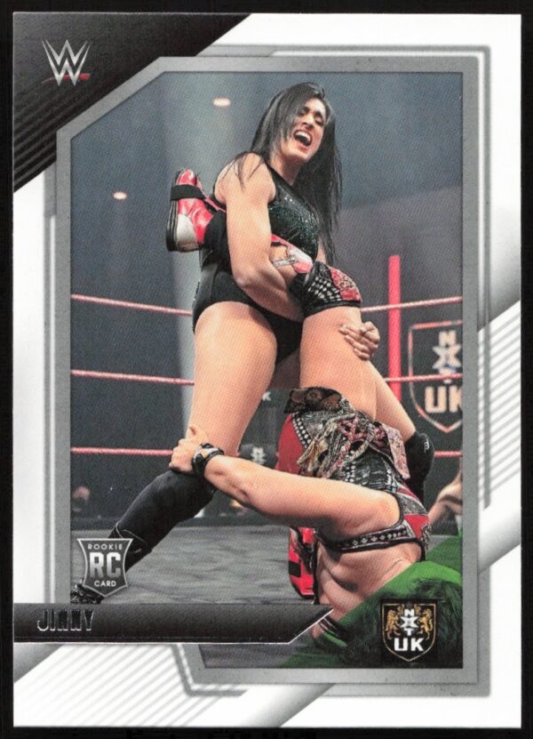 Dynamic WWE NXT card: Jinnys powerful move in vivid arena. Part of 2022 Panini series.
