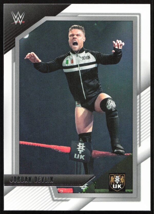 WWE trading card featuring Jordan Devlin in action on the top rope of the ring.
