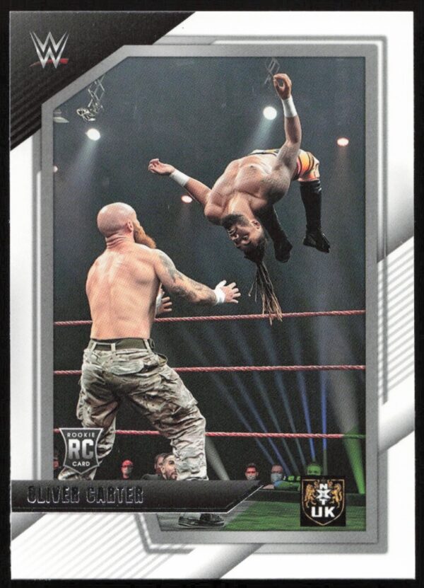 Oliver Carter performs aerial stunt in WWE NXT 2.0 trading card with WWE logo.