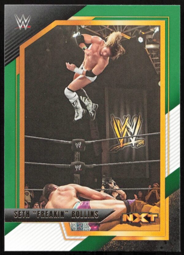 Seth Rollins performs an aerial maneuver at WWE NXT event, captured on a trading card.