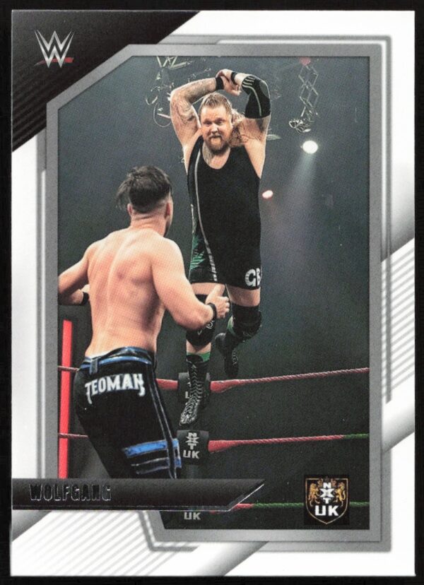 Roman Reigns vs. Wolfgang in dynamic WWE action on collectible NXT UK trading card.