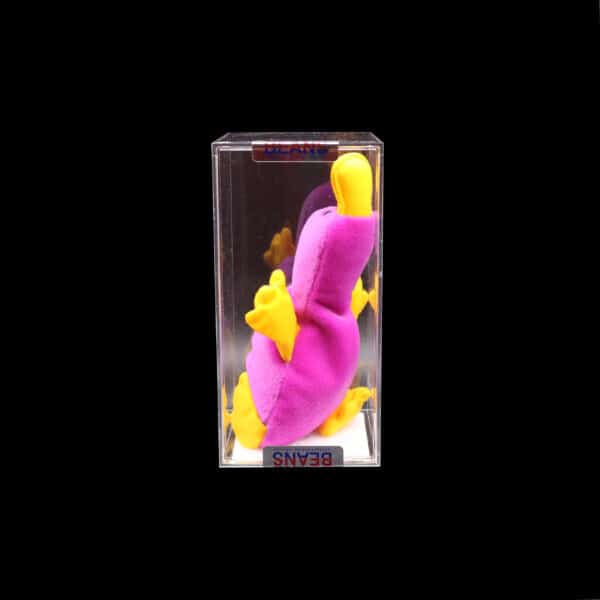 Colorful abstract sculpture in display case against dark background, featuring pink and yellow hues.