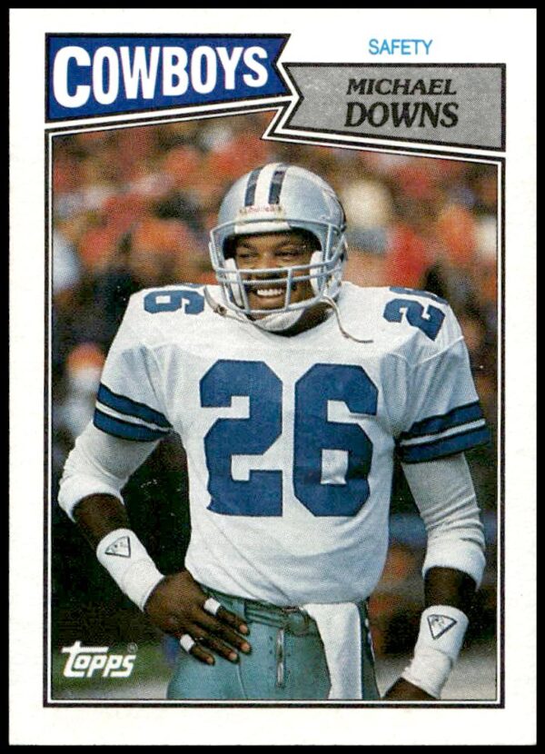 1987 Topps Michael Downs NFL card #271 featuring Dallas Cowboys safety in action.