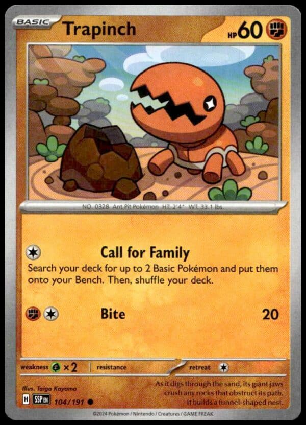 Trapinch Pokémon card from 2024 Surging Sparks set, featuring desert habitat illustration.
